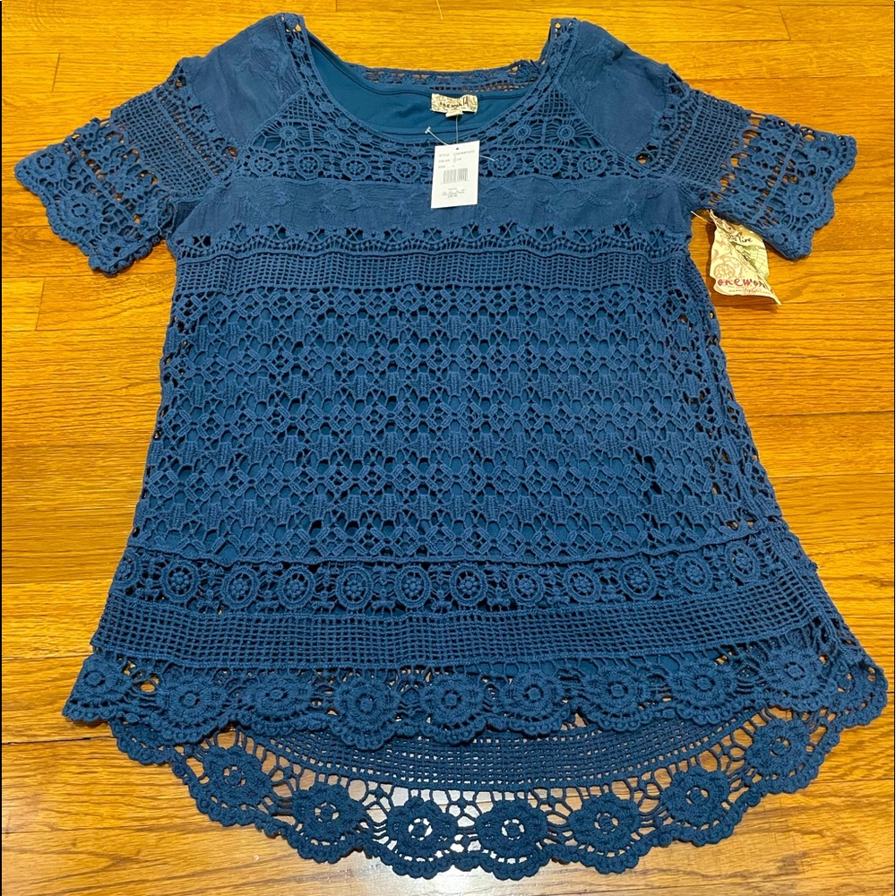 NWT Beautiful blue top with liner. Size Large. Excellent new condition.